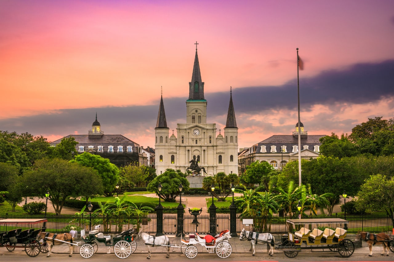 Horse drawn carriages at Jackson Square historic park in the French Quarter of New Orleans, Louisiana.