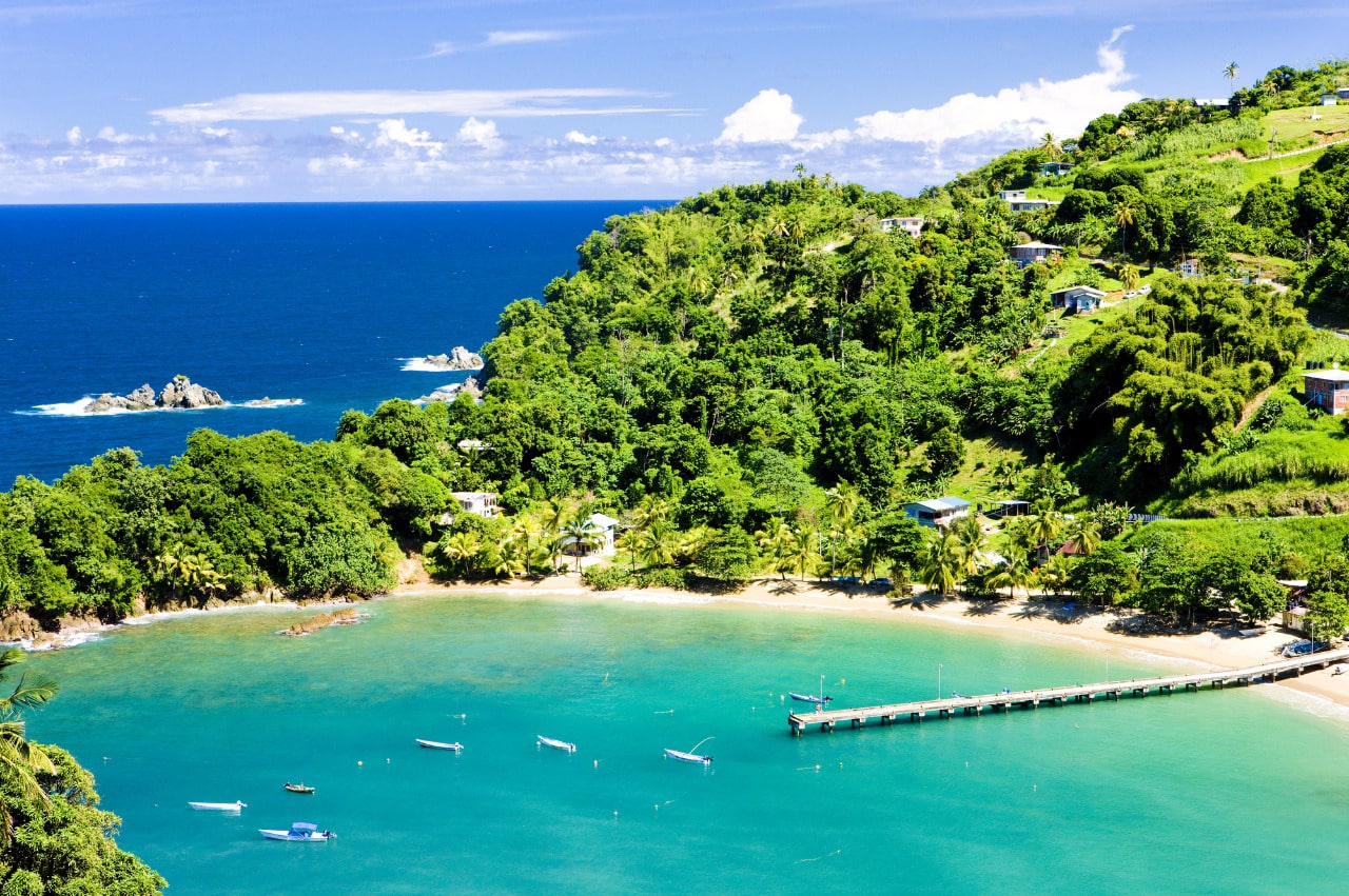 Sandy beaches and boats on a sunny day at Tobago Island, part of Trinidad and Tobago.
