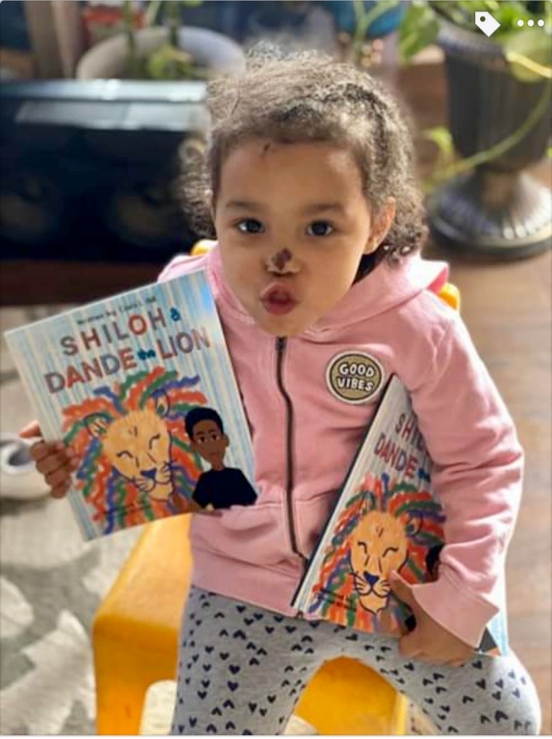 little girl in pink with shiloh books