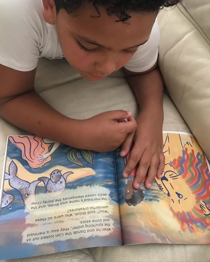 Kid laying down to read