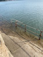 Stairs to get in the water just off the road.