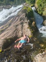 Refreshing mountain ice water rinse after the swim
