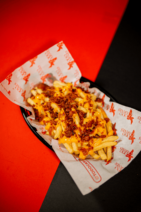 Papas con Cheddar y Tocineta