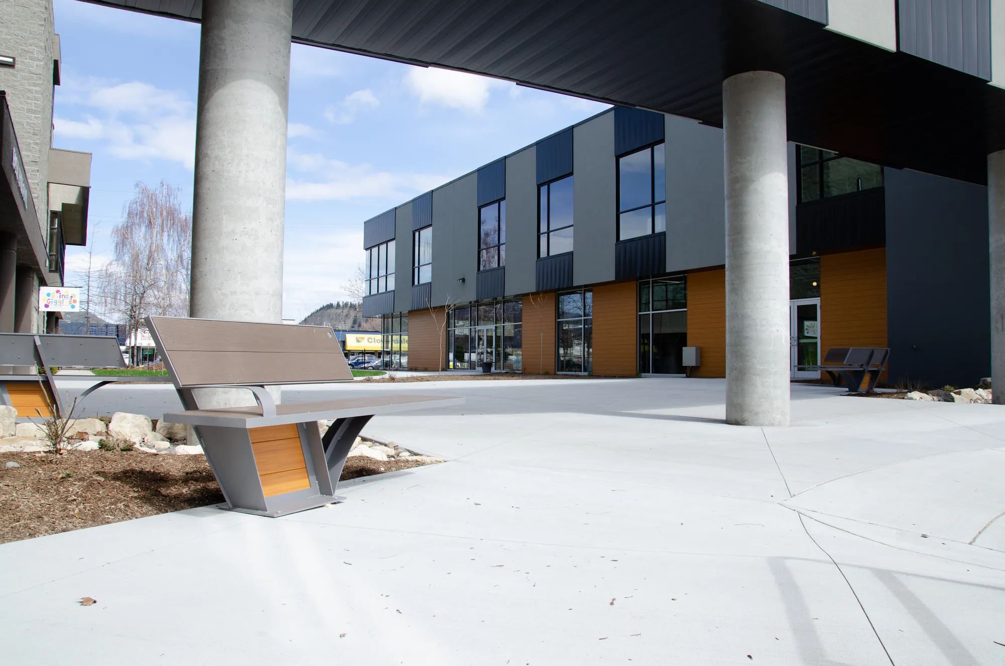 These City Scape benches offer a place to rest in a modern outdoor setting. The benches feature recycled plastic lumber and powder-coated metal frames.
