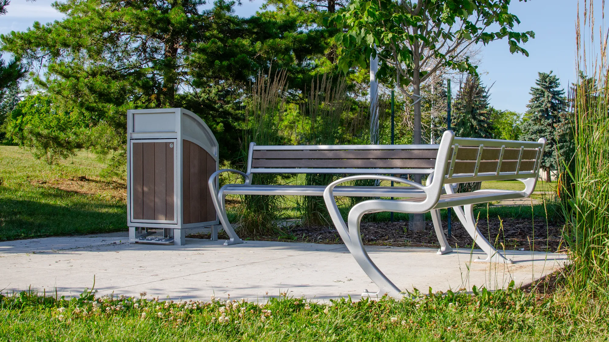 Wishbone TENAJ Benches and Modena Curved Top Waste Receptacle at