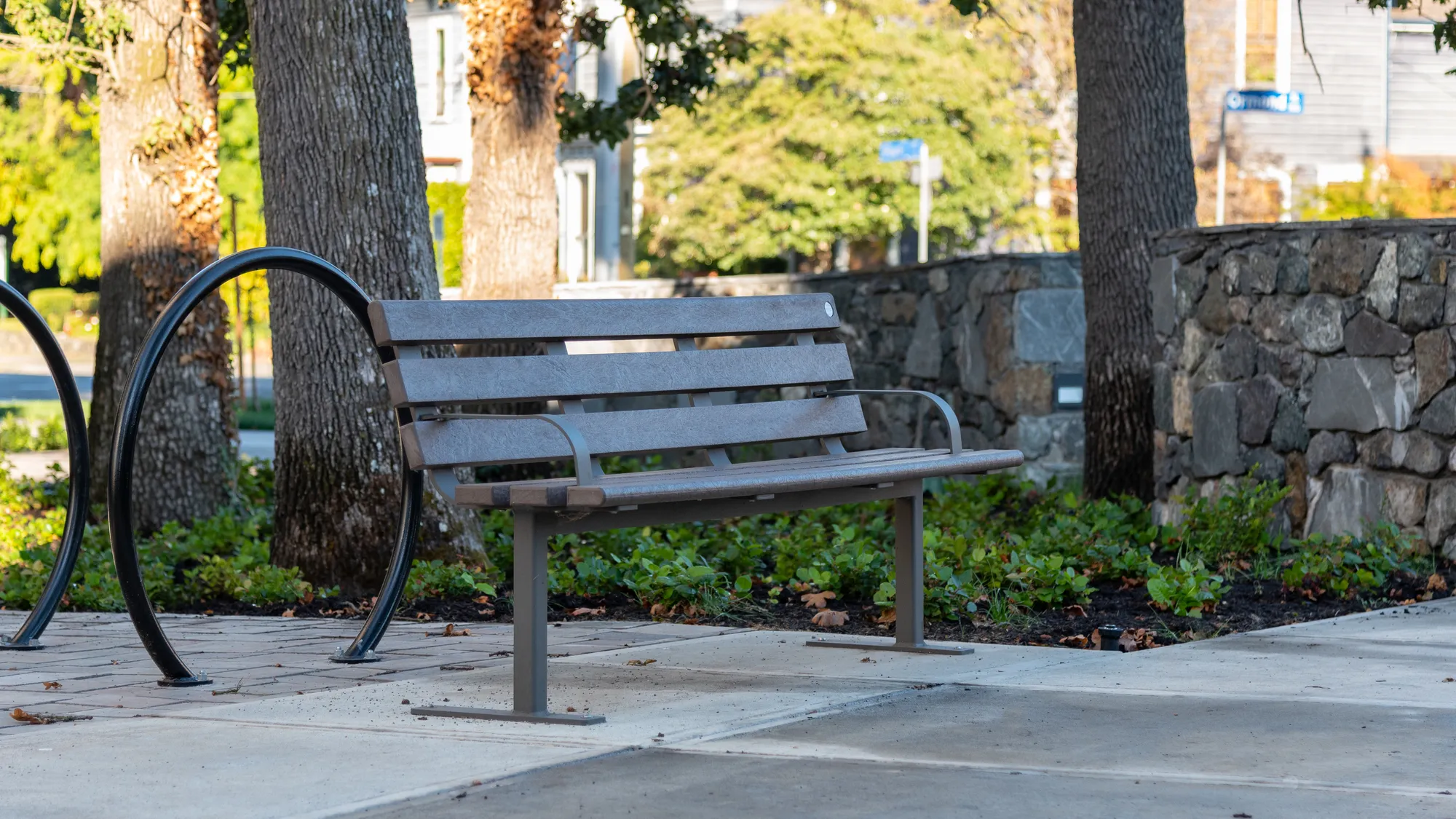 Wishbone Standard Bench with Armrests and Loop Bike Racks at Bel