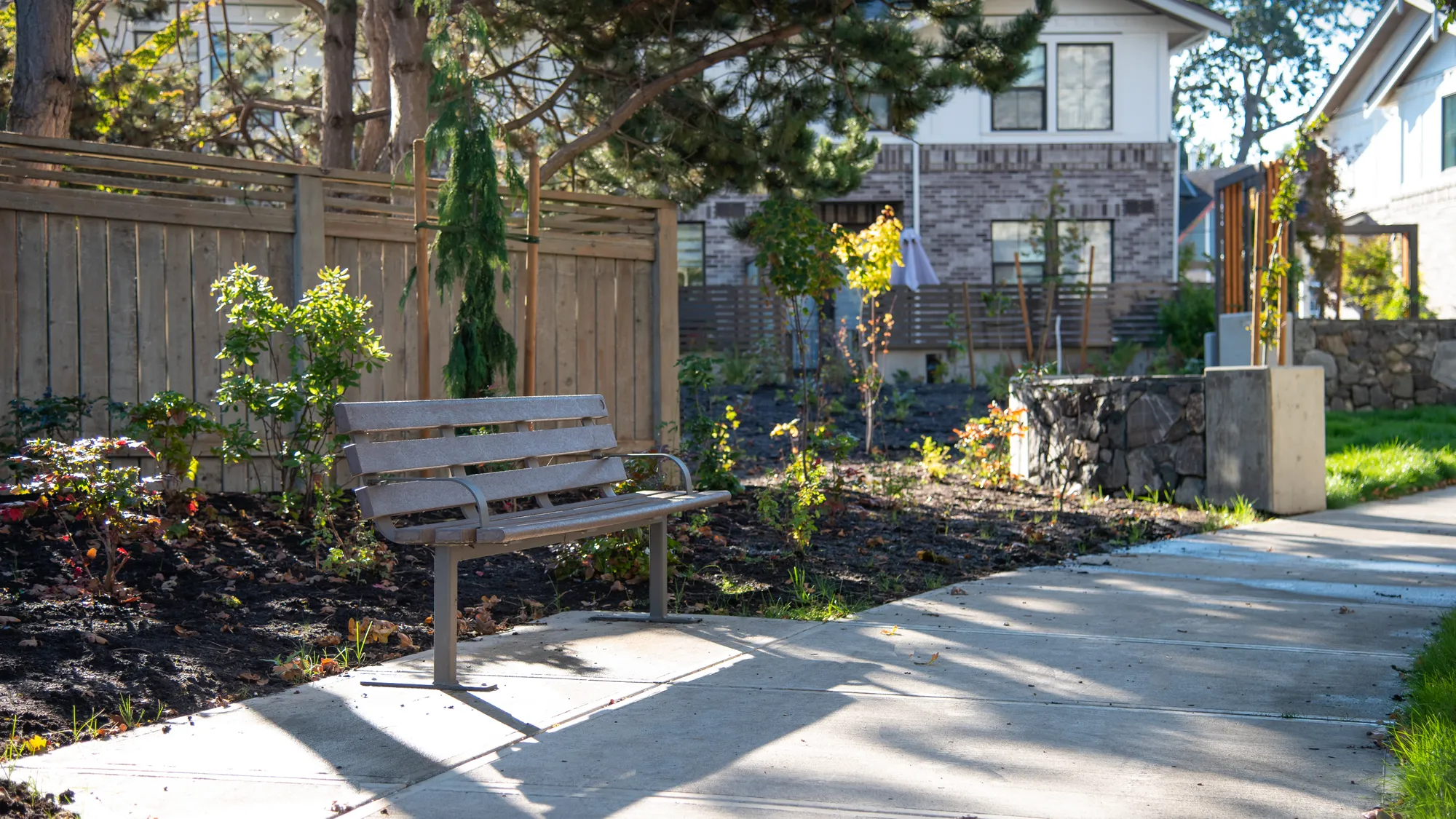 Wishbone Standard Bench with Armrests at Bellewood Park in Victo