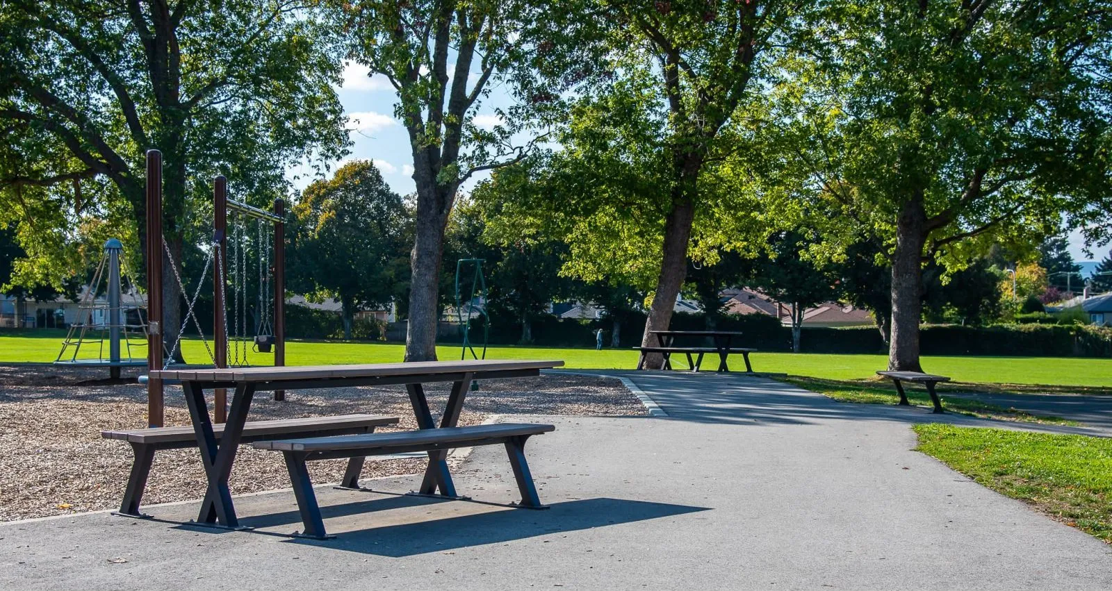 Bayview picnic tables offer a place to rest in Reynolds Park, Saanich, British Columbia. The picnic tables are constructed with recycled plastic lumber and powder-coated metal frames.