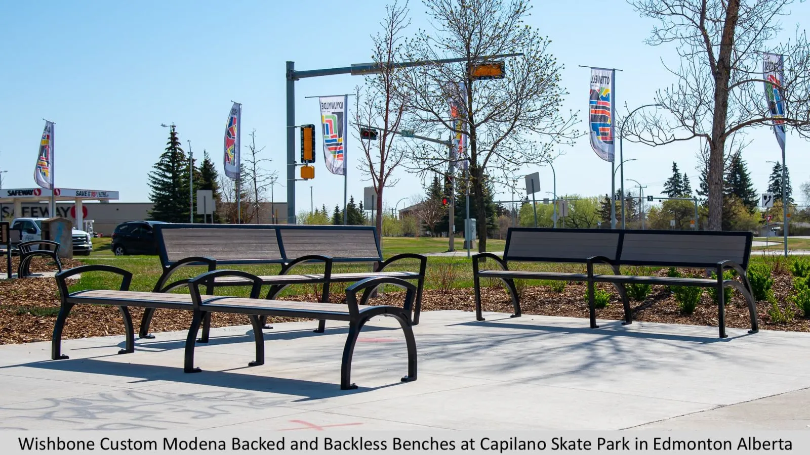 Modena benches with and without backs provide seating at Capilano Skate Park. The benches feature recycled plastic lumber seats and powder-coated metal frames.