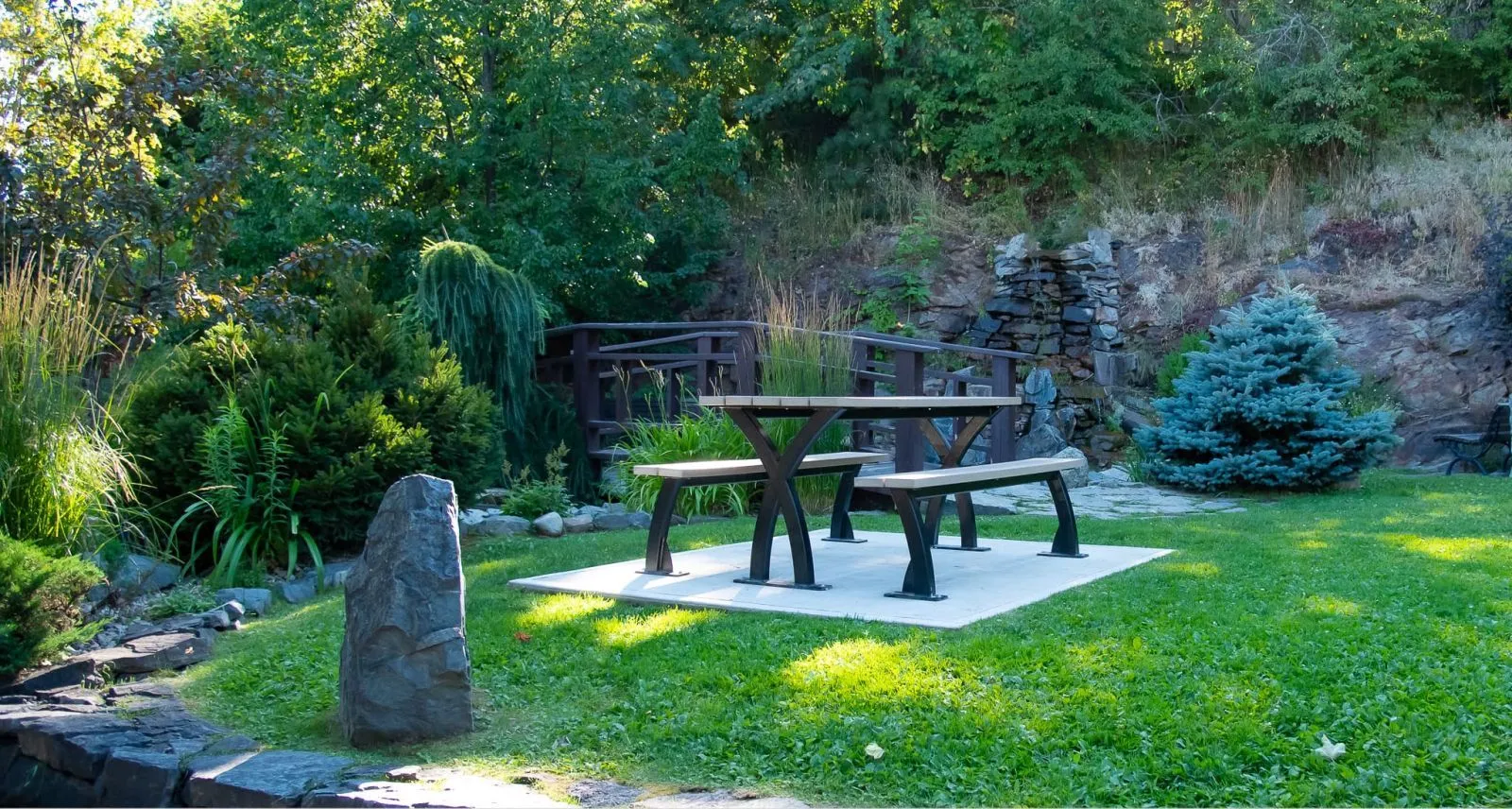 The Parker Picnic Table provides a comfortable and stylish outdoor dining space. Its sturdy construction and classic design make it a great addition to any park or garden.