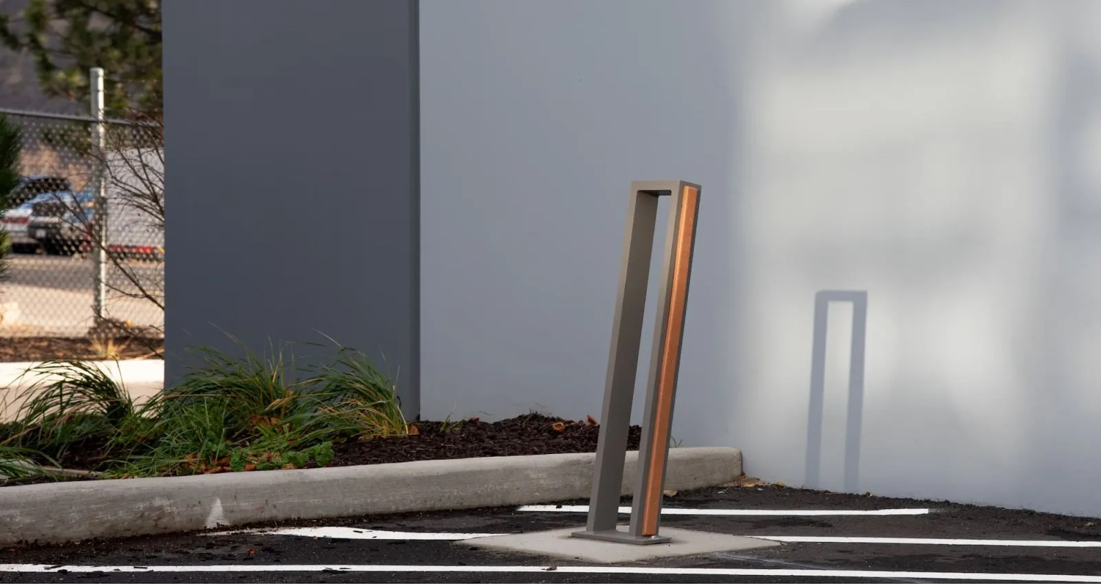 Urban Form 2 Space Bike Rack provides secure bicycle parking. The rack features a modern design with a powder-coated finish and space-saving layout.