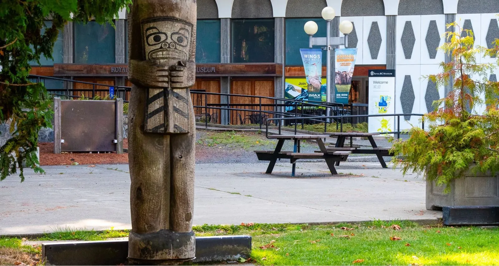 Bayview Hexagonal Wheelchair Accessible Picnic Tables provide inclusive outdoor seating at the Royal BC Museum in Victoria, British Columbia. The tables offer a welcoming space for visitors to relax and enjoy the museum grounds.