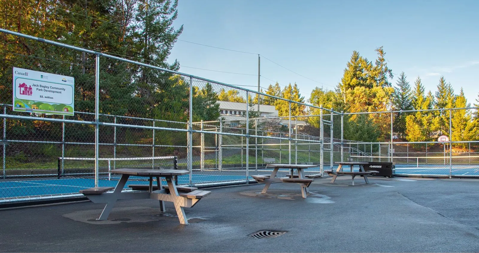 These accessible picnic tables provide a welcoming space for outdoor dining and recreation. The tables feature durable construction and a design that accommodates wheelchair users.