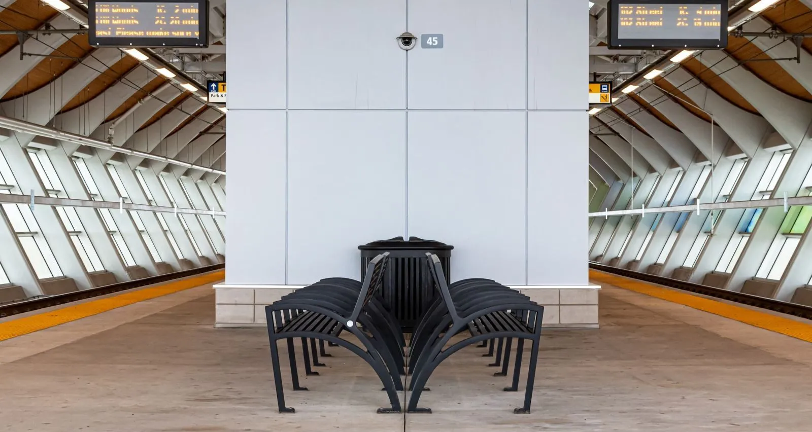 Modena benches provide seating at the Davies Transit Centre LRT station in Edmonton, Alberta. The benches feature a black powder coat finish.