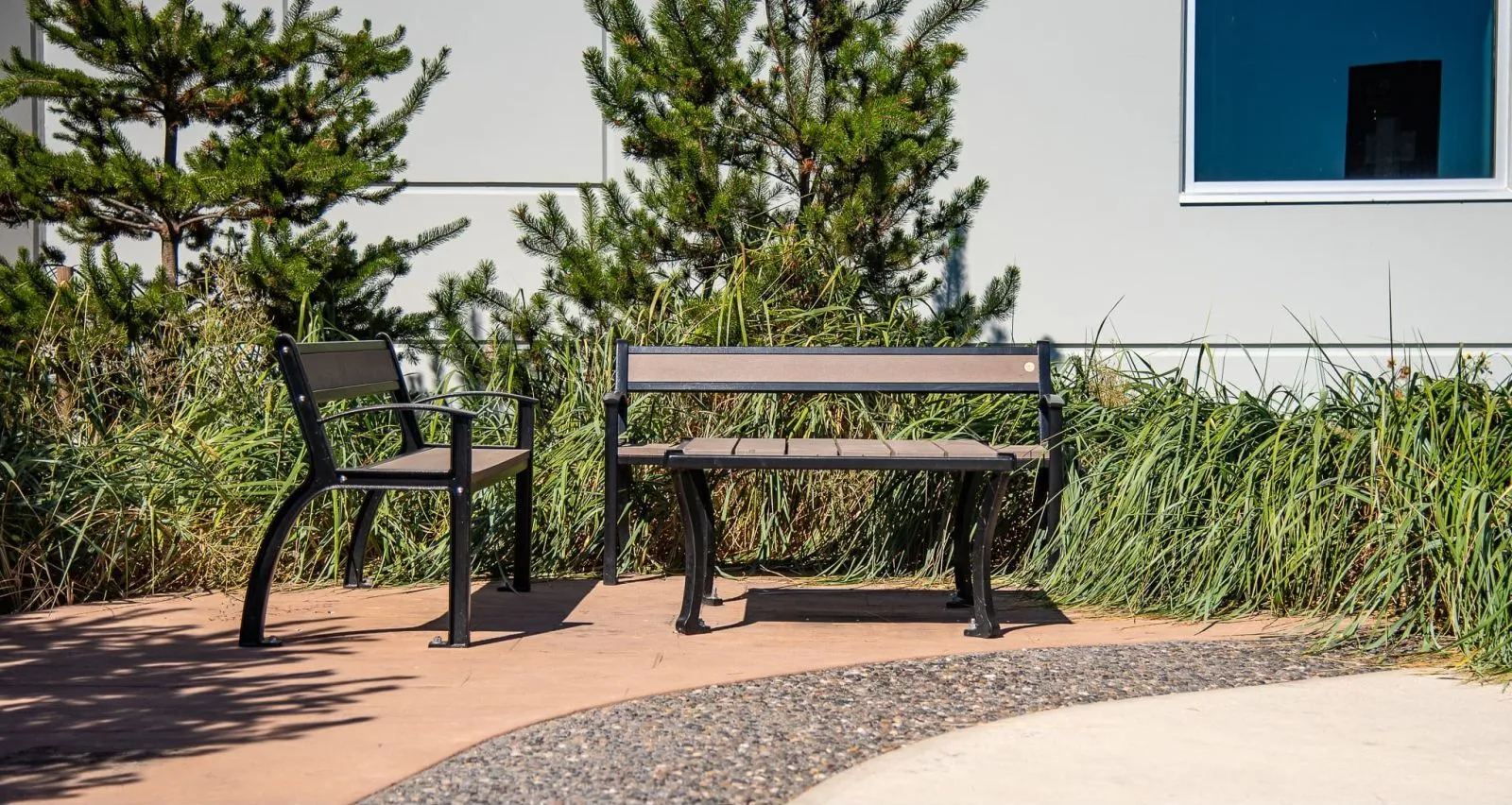 Beselt chair and bench create a comfortable seating area in an outdoor space. The recycled plastic lumber provides a durable and attractive finish.