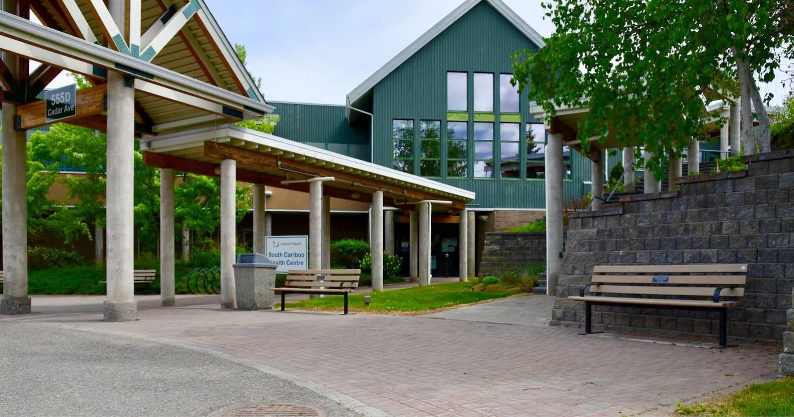 Standard Memorial Benches with armrests provide seating at the South Cariboo Health Centre. The benches are made with recycled plastic lumber and powder-coated metal frames.