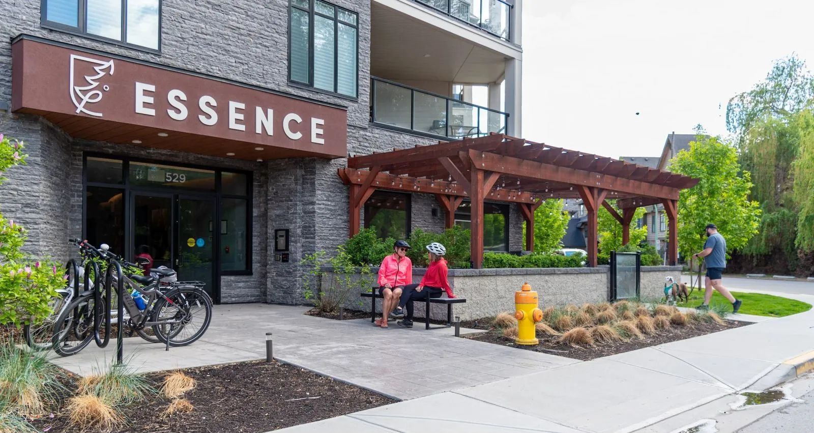 Skyline bench provides seating outside the Essence building in Kelowna, British Columbia. The backless bench offers a place to rest near the entrance.