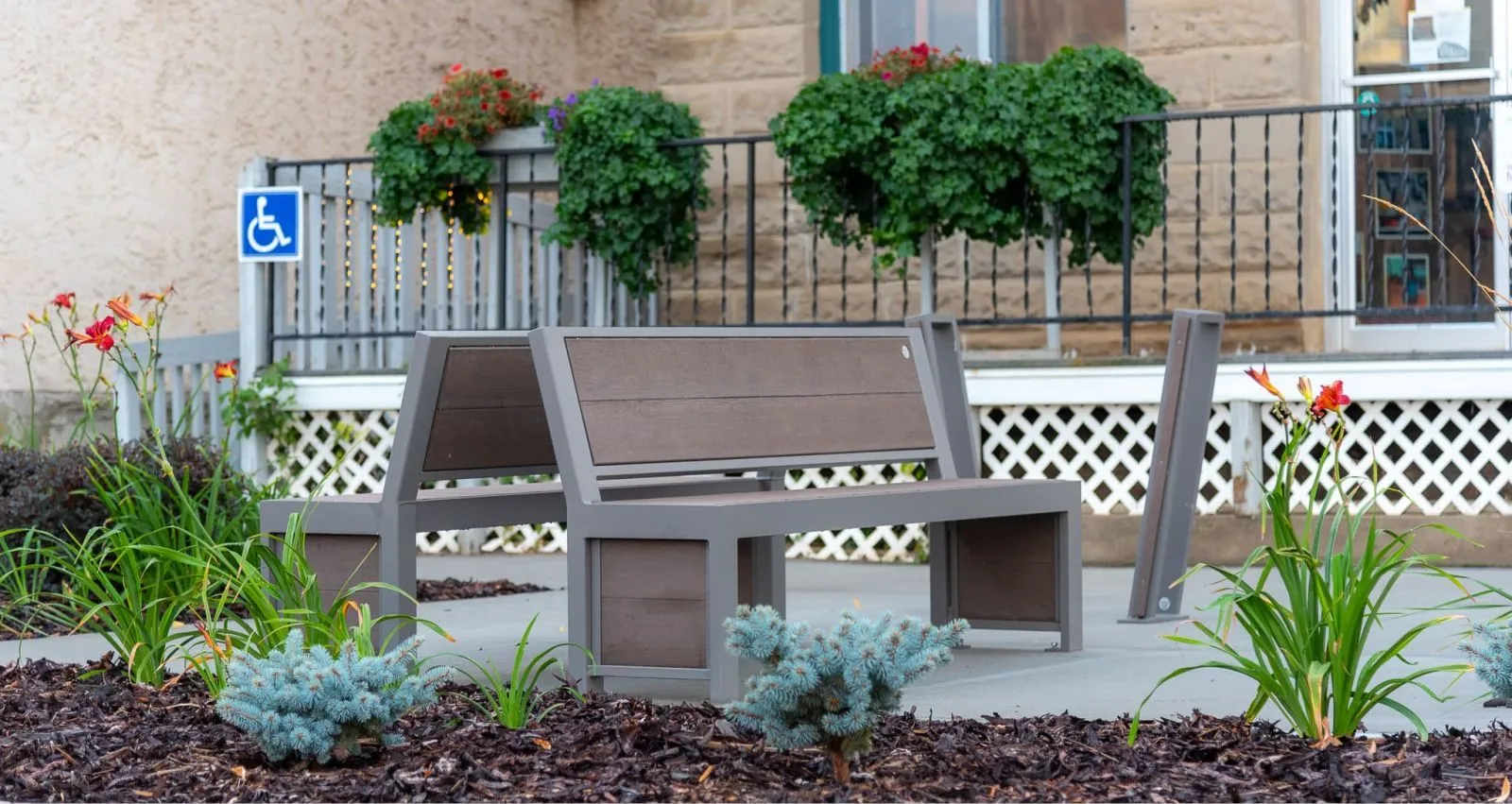Urban Form Full Back benches provide comfortable seating in Sedgewick, Alberta. The benches feature recycled plastic lumber and a powder-coated metal frame.