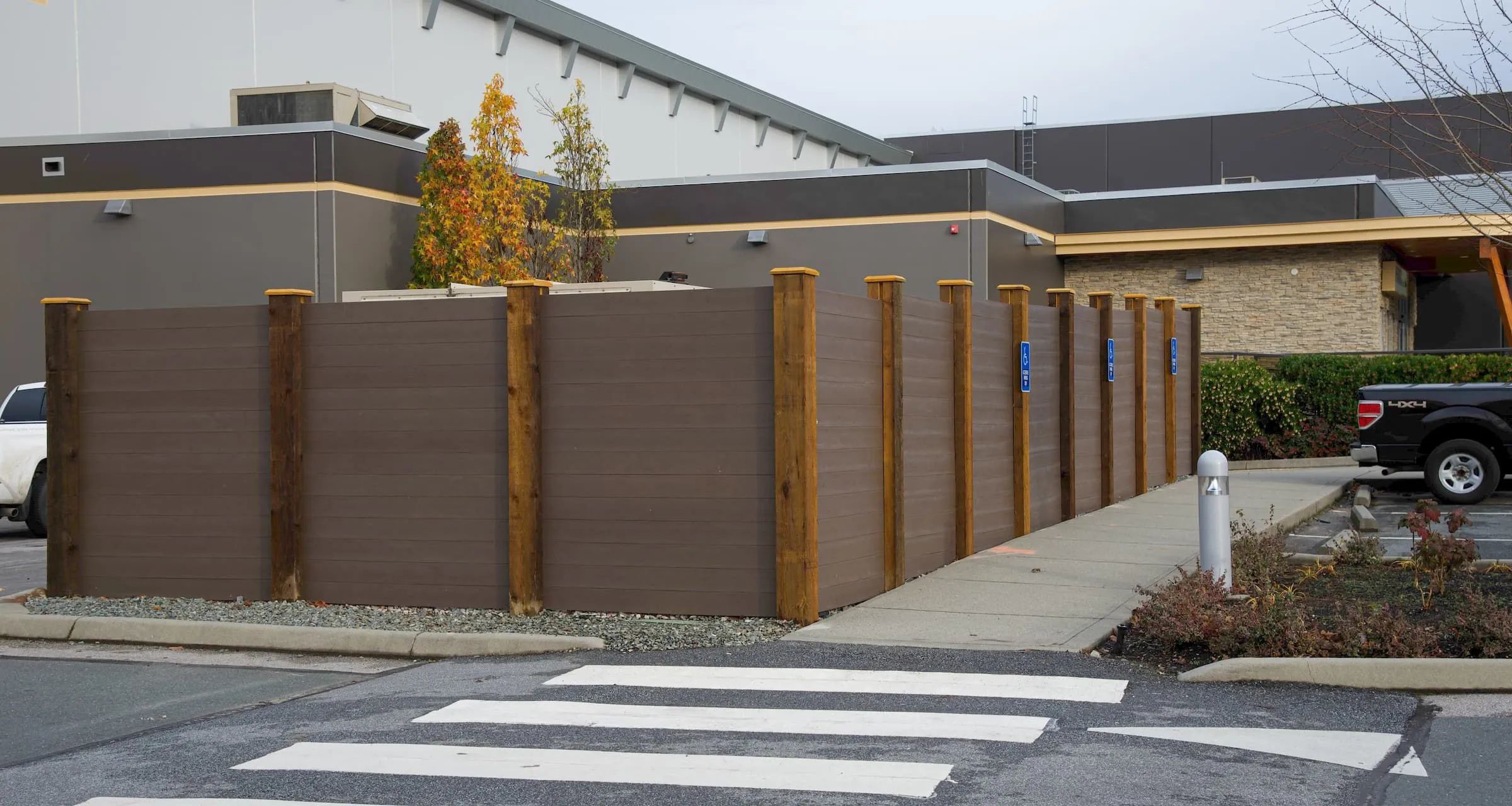 Screening provides privacy and enclosure in an outdoor commercial setting. The recycled plastic lumber offers a durable and low-maintenance solution.