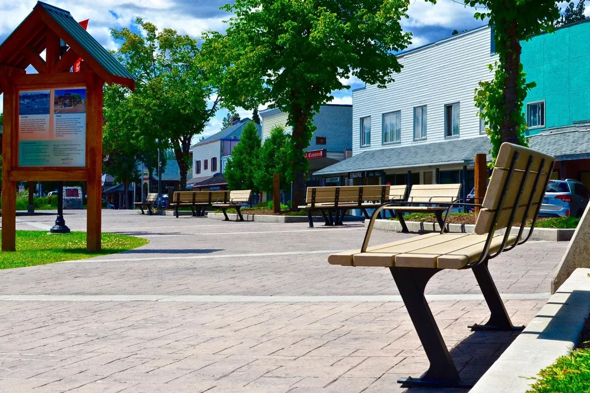 Bayview benches line a pedestrian area in Princeton, British Columbia. The benches feature recycled plastic lumber and a durable powder-coated metal frame.