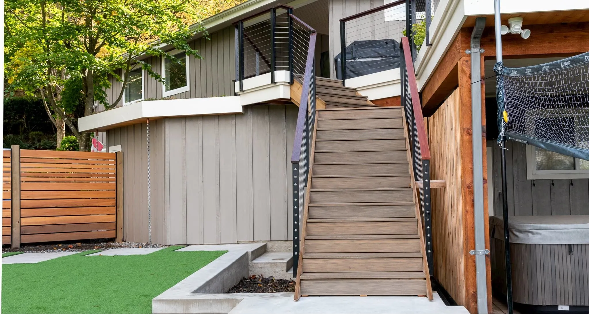 Perma-Deck stair treads with standard gap, featuring Havana Brown recycled plastic lumber. These durable and attractive stair treads enhance the exterior of this home in Langley, BC.