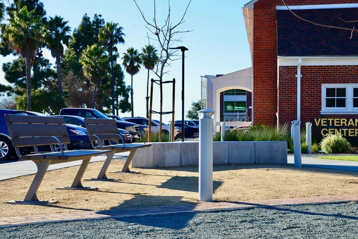 Bayview benches provide seating outside the Veteran Center at the California Maritime Academy in Vallejo, California. The benches feature recycled plastic lumber and a powder-coated metal frame.