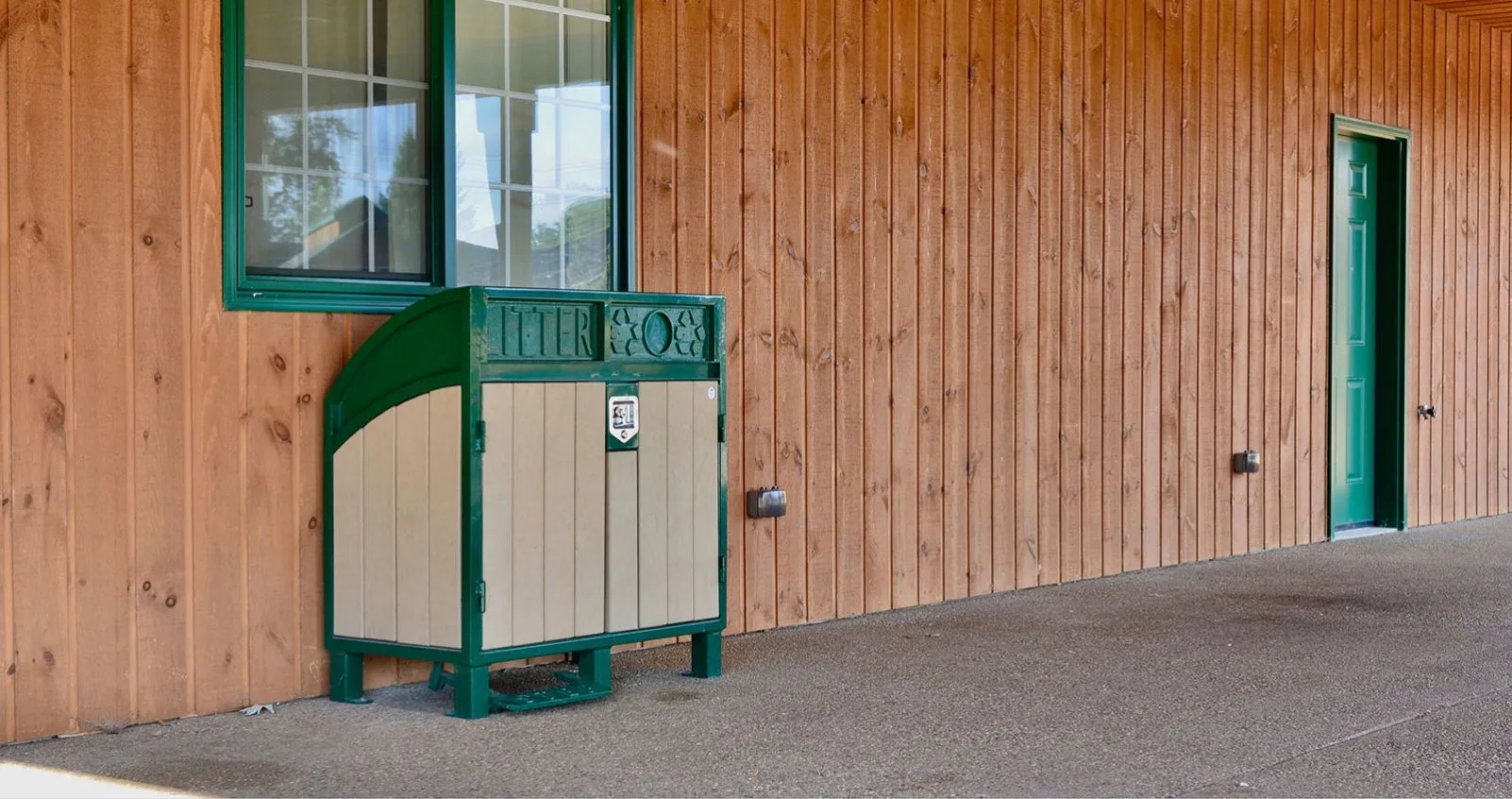 Two-stream Modena recycling station featuring recycled plastic lumber and powder-coated metal. This litter and recycling receptacle is ideal for parks, schools, and commercial spaces.