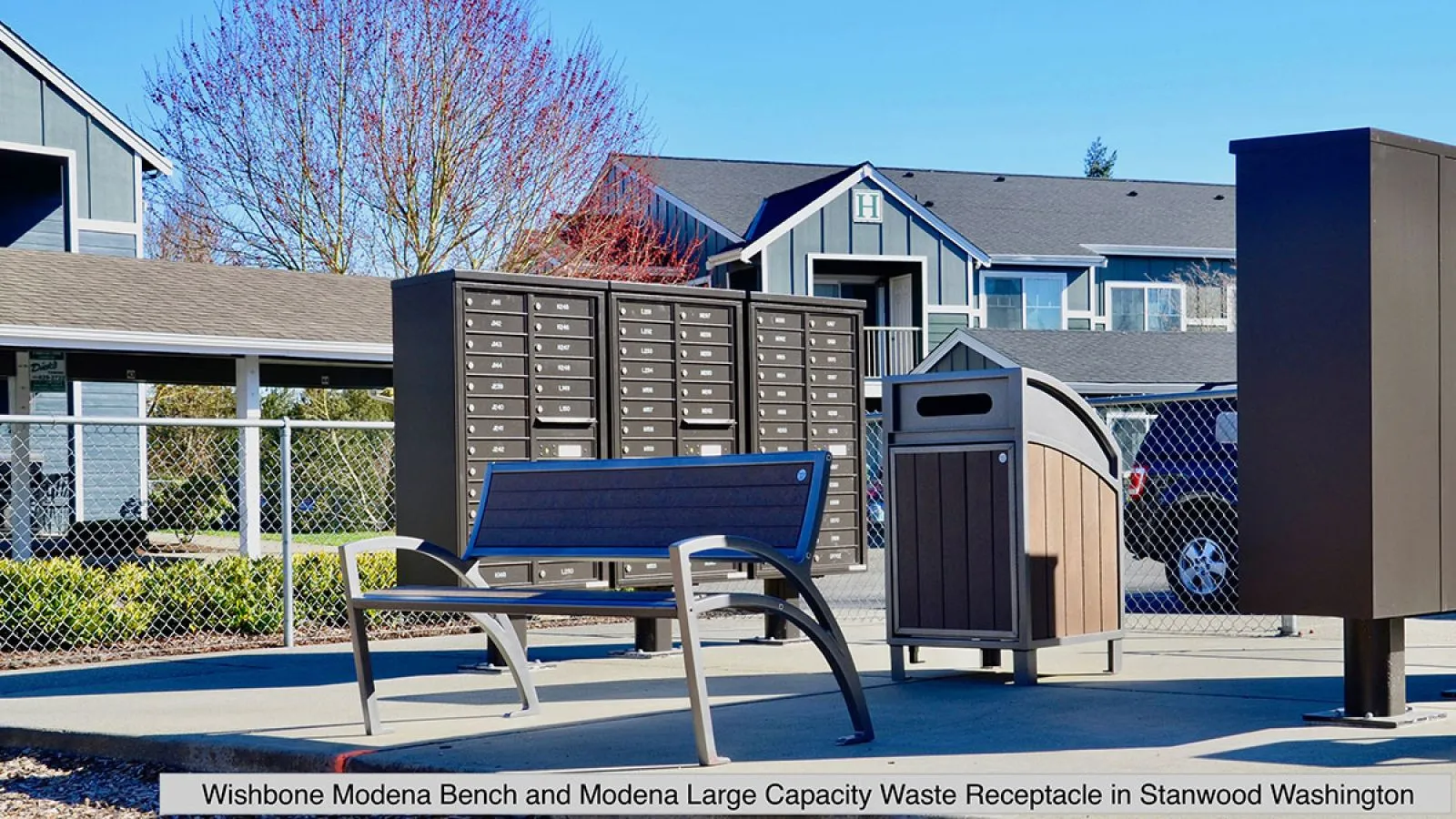 Outdoor seating and waste management solution featuring a bench and large capacity waste receptacle. The bench provides a comfortable place to rest, while the waste receptacle helps keep the area clean and tidy.