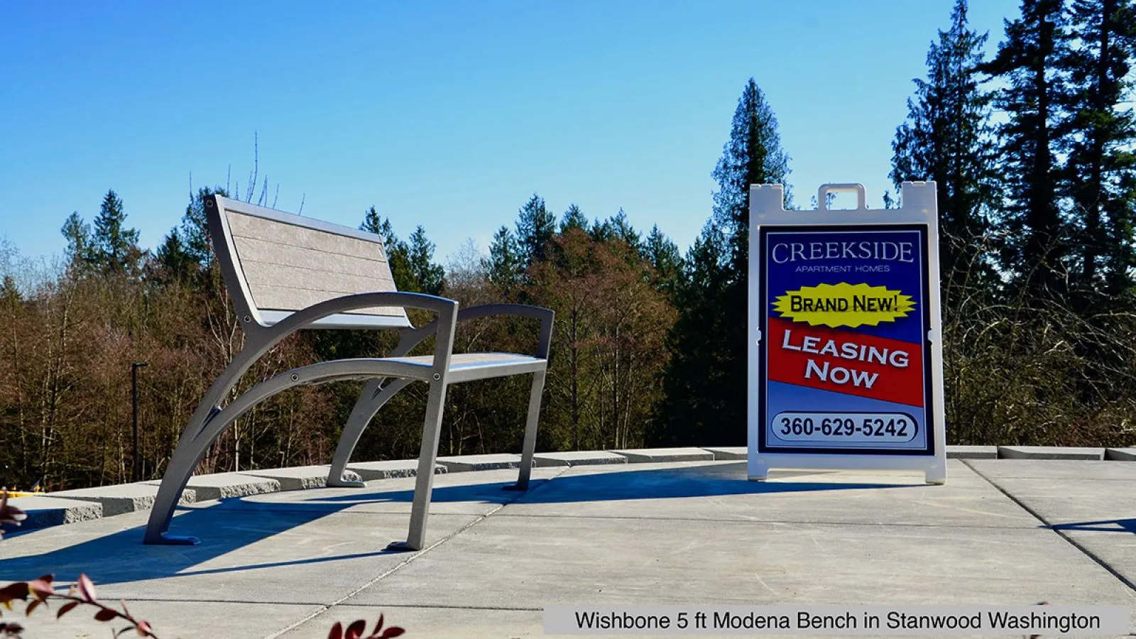 A 5-foot Modena bench provides seating outside the Creekside Apartment Homes. The bench features recycled plastic lumber and a powder-coated metal frame.