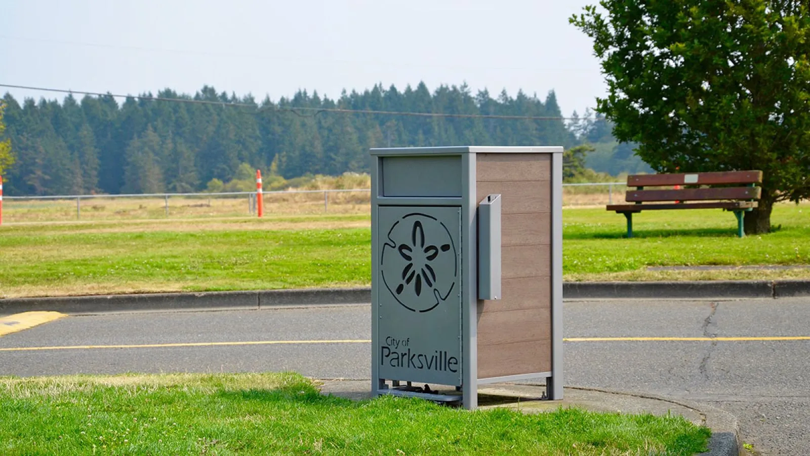 Urban Form waste receptacle with custom graphics for the City of Parksville, British Columbia. The bin features recycled plastic lumber and powder-coated metal.