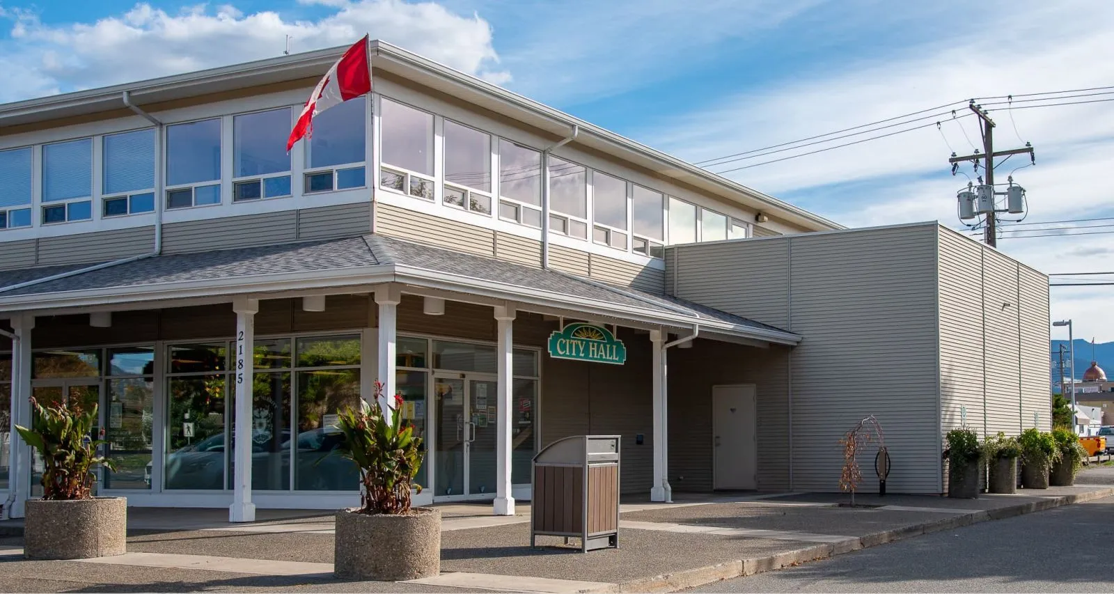 Freedom 55 Bear Resistant Waste Receptacle stands outside Merritt City Hall in British Columbia. The receptacle features recycled plastic lumber and a powder-coated metal frame.