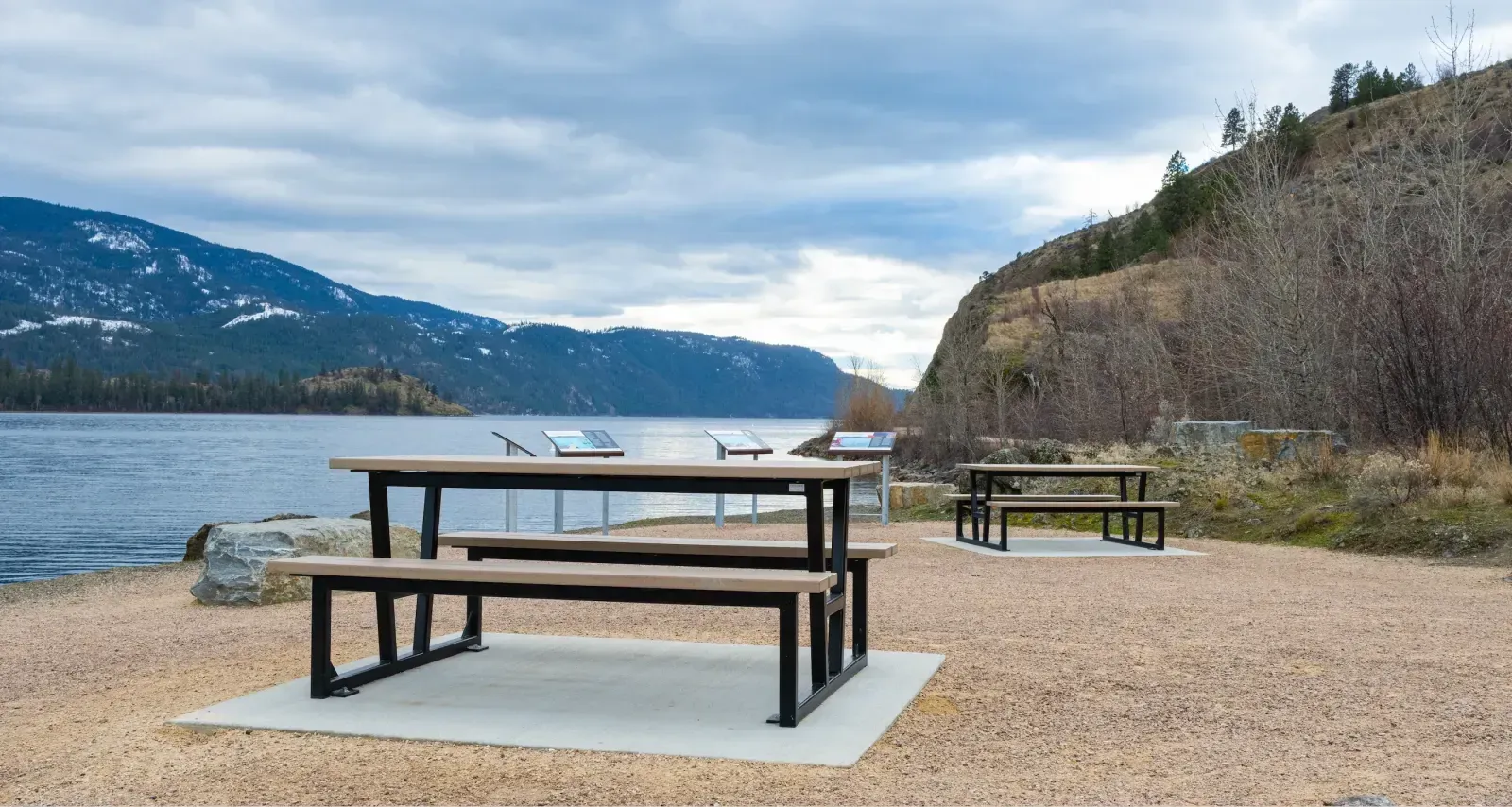 Rutherford picnic tables provide a scenic rest stop along the Okanagan Rail Trail near Vernon, British Columbia. The tables feature recycled plastic lumber and durable metal frames.