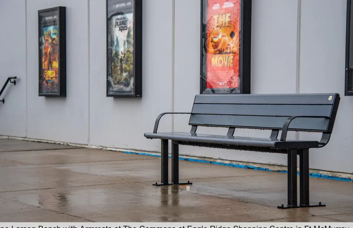 Larson bench with armrests provides seating at The Commons at Eagle Ridge Shopping Centre in Fort McMurray, Alberta. The bench features a black powder coat finish.