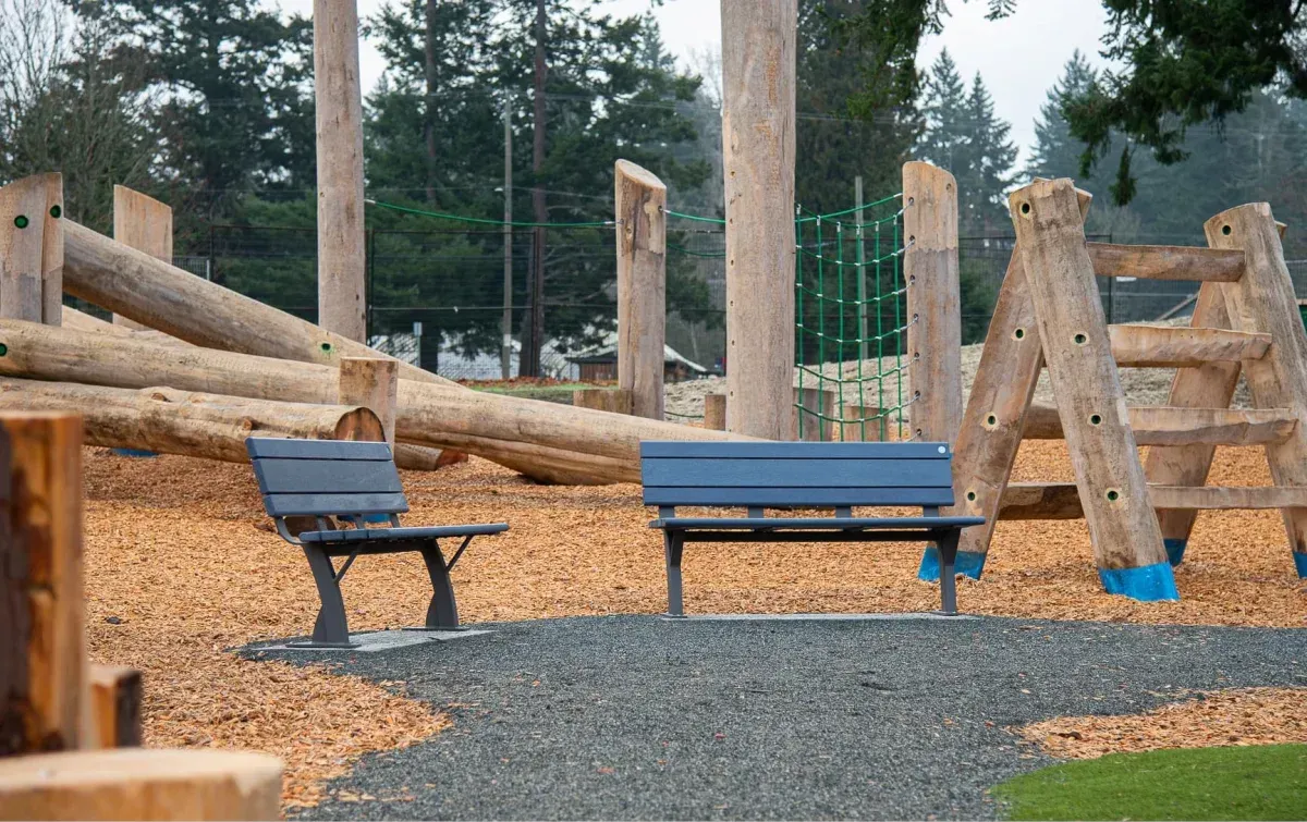 Two Parker benches provide seating at Elk/Beaver Lake Regional Park in Saanich, British Columbia. The benches are constructed with recycled plastic lumber and powder-coated metal frames.