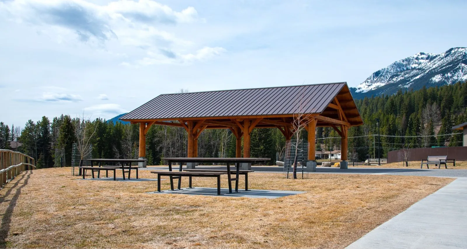 Wheelchair accessible picnic tables provide an inclusive outdoor dining space. The tables feature recycled plastic lumber and a durable metal frame.