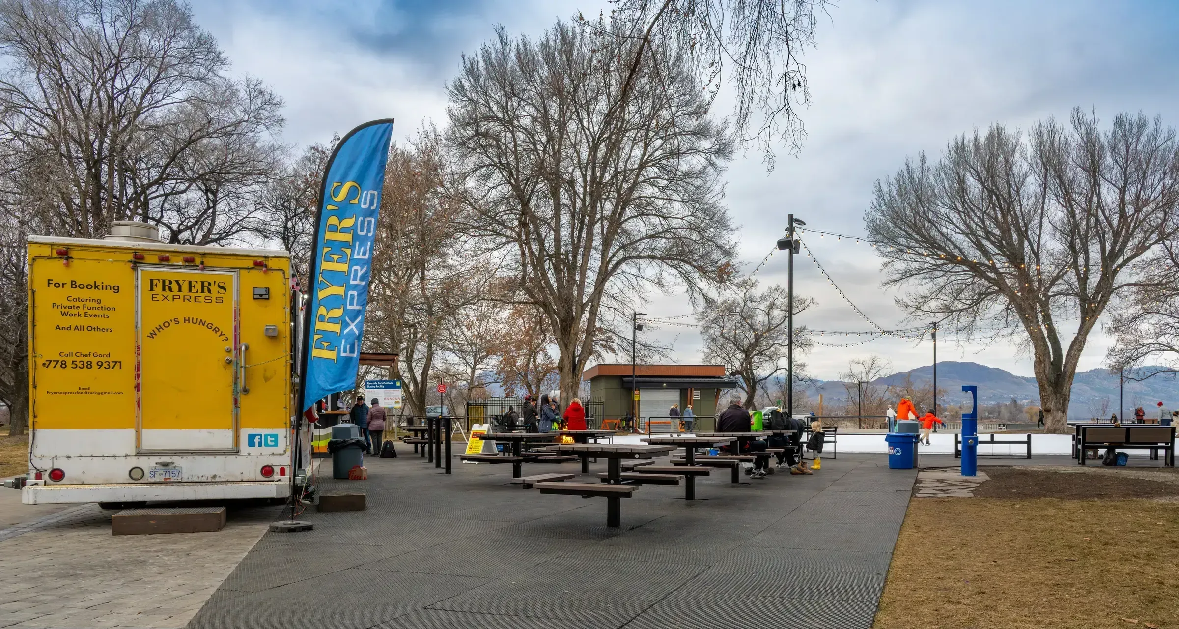 These single pedestal picnic tables provide a place for visitors to relax and enjoy the outdoor skating loop. The tables offer a convenient spot to eat and socialize in this park setting.