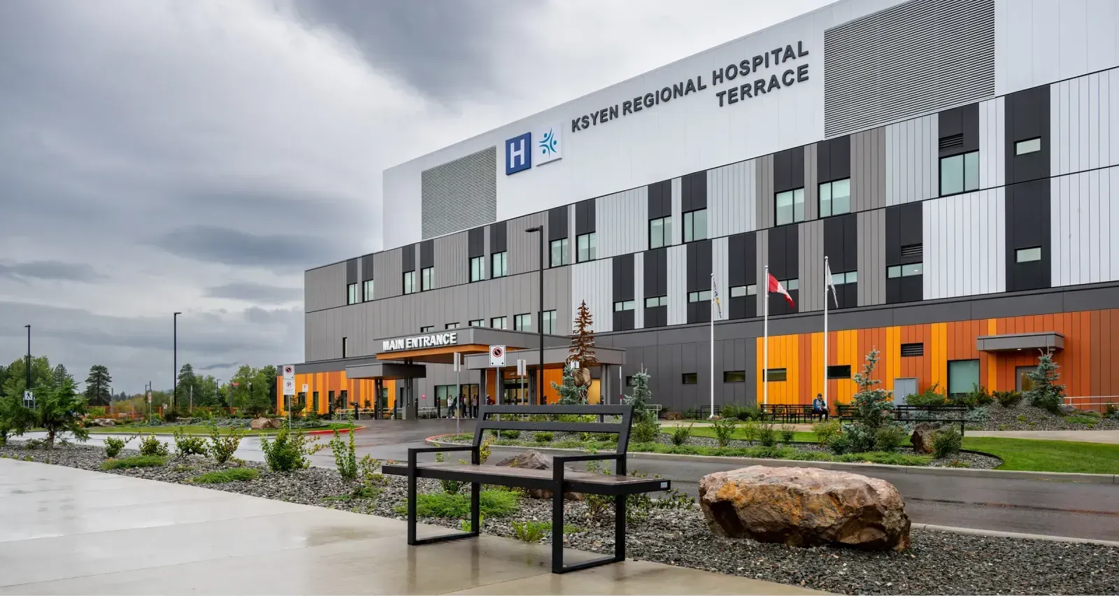 Skyline bench provides seating outside the KSYEN Regional Hospital in Terrace, British Columbia. The bench offers a place to rest near the main entrance.