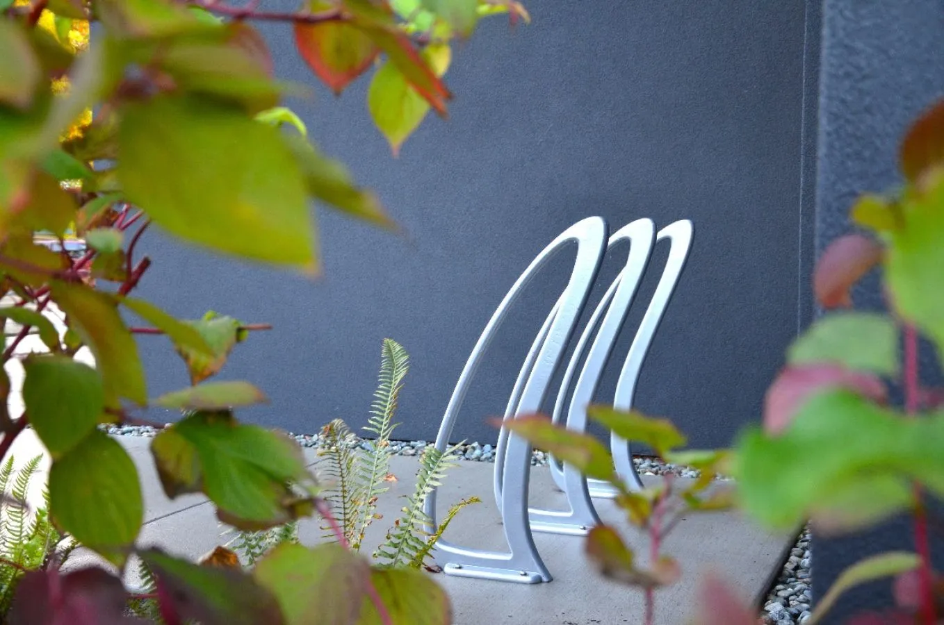 These TENAJ bike racks provide convenient and secure parking for cyclists. The sleek design complements the modern architecture of Coast Capital Savings in Victoria, BC.