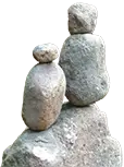 Pebbles balanced on each other in a stream