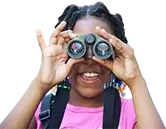 Girl looking through binoculars