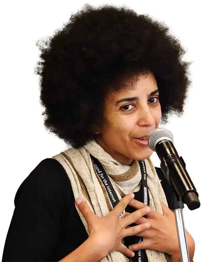 Individual speaking at microphone