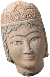 Photo of a crowned head sculpture carved from limestone from the Khalili Collection.