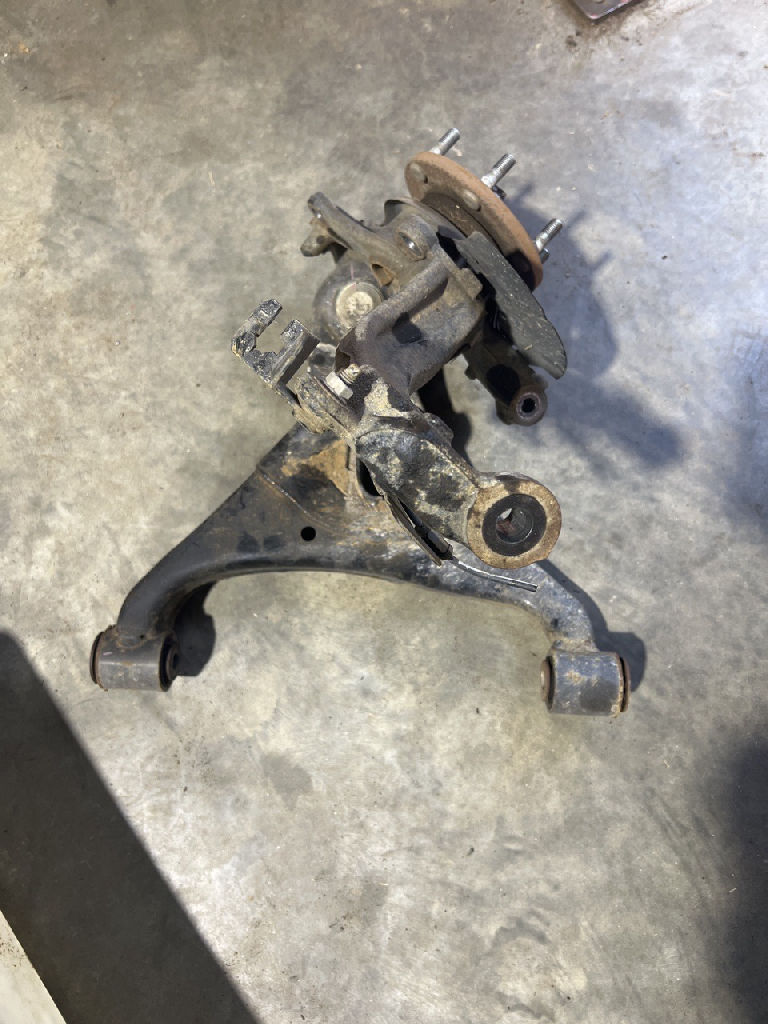 KNUCKLE - STUB AXLE with bearing and lower control arm LEFT LHF