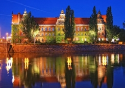 Museum by night with a reflection in Odra