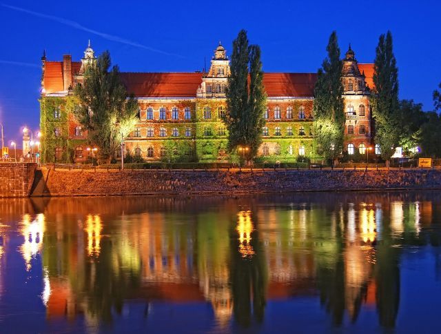 Museum by night with a reflection in Odra