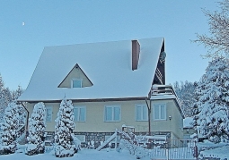 house in winter clothes