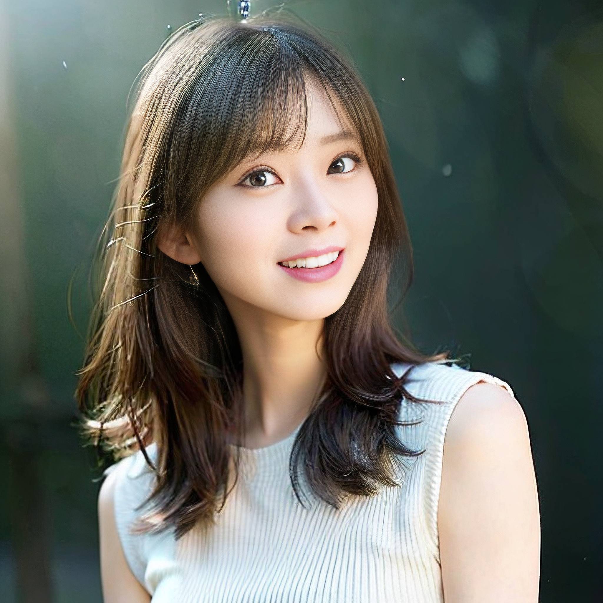 a beautiful young woman posing for a picture 