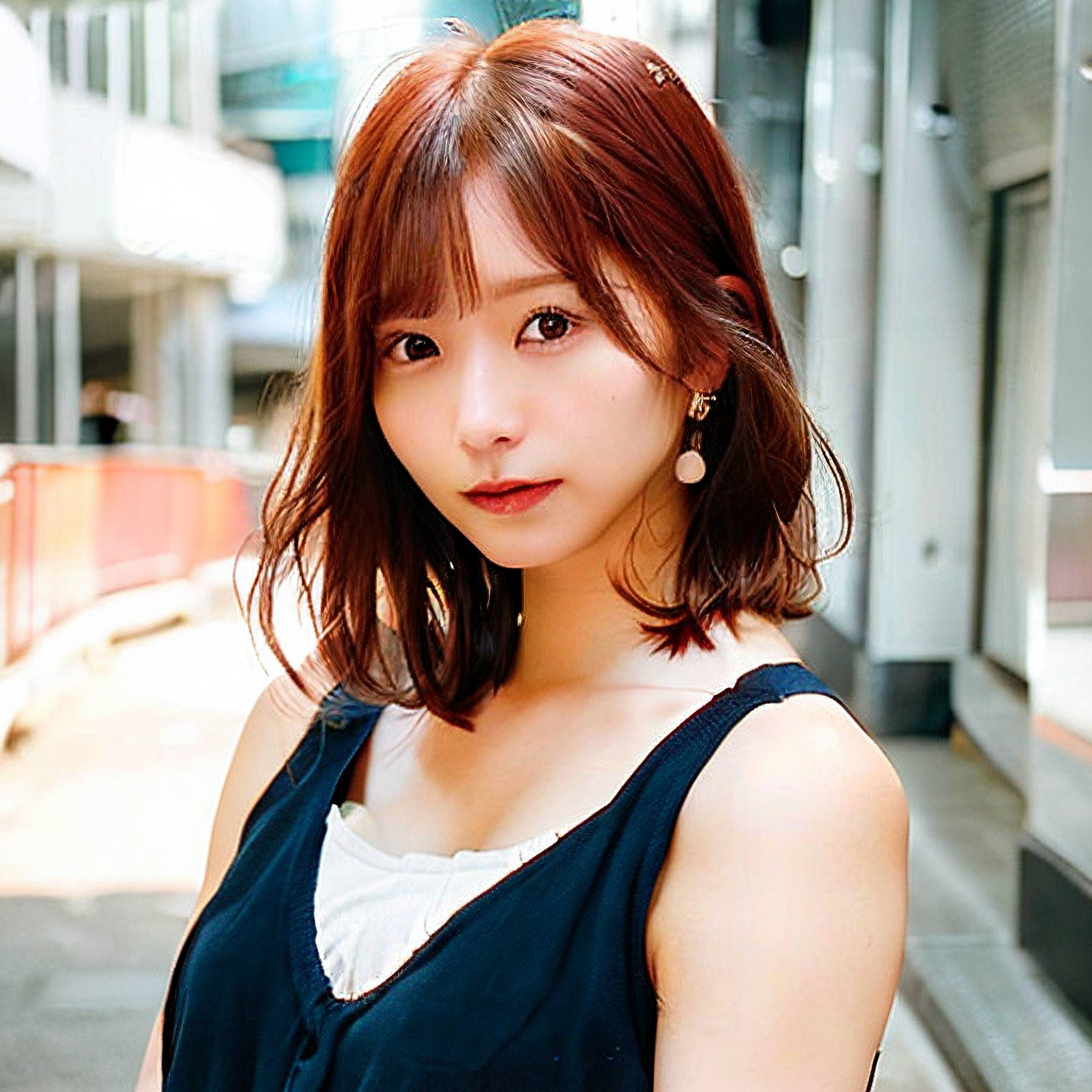 a woman is standing in front of a building 