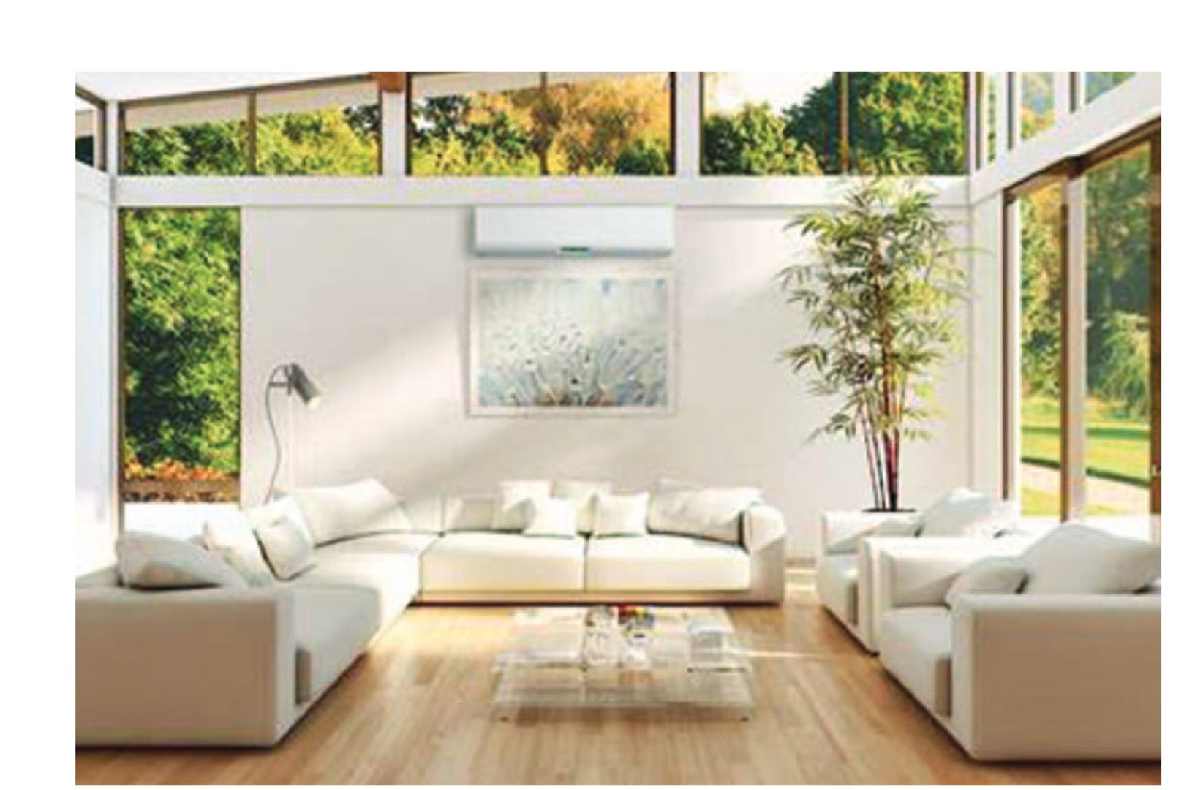 A modern living room with large windows and white furniture.