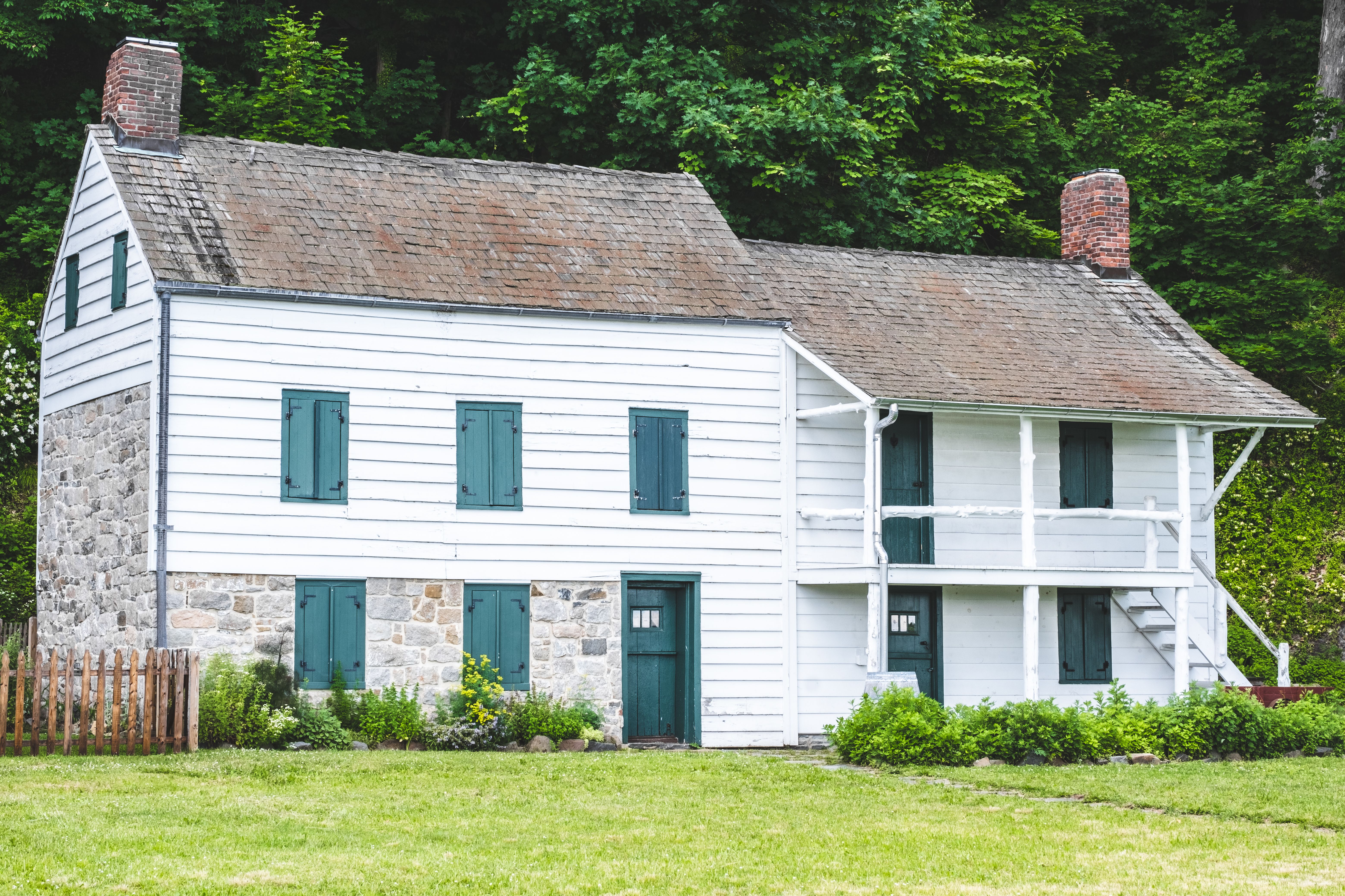 A charming Colonial-style home in the Lehigh Valley region, showcasing its architectural beauty. The focus is on the exterior, highlighting the potent